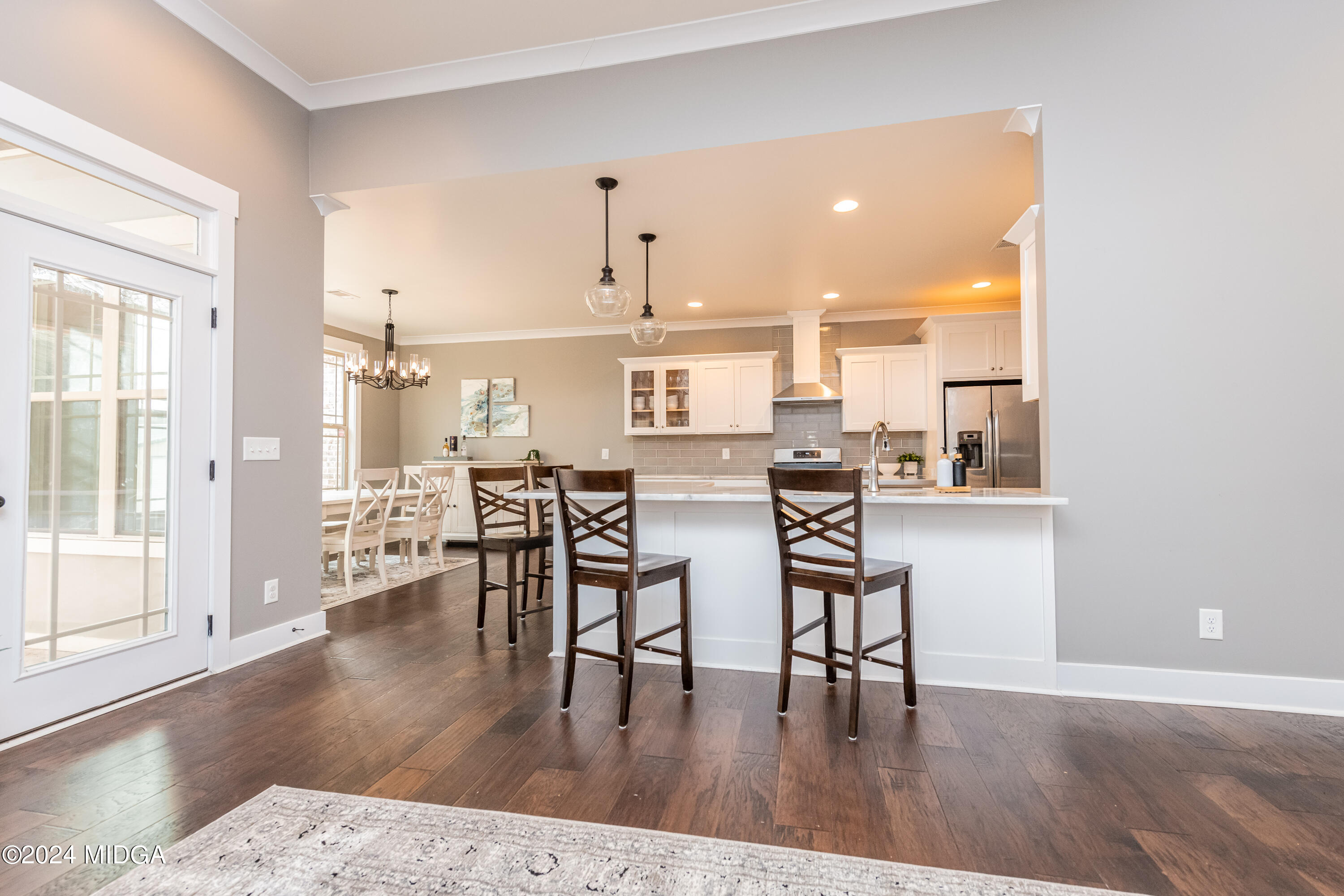 158 Harper Road Perry, GA 31069 - Photo 8 of 46 a open kitchen with a table and chairs in it