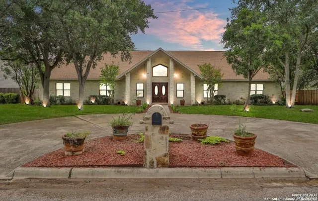 front view of a house with a garden