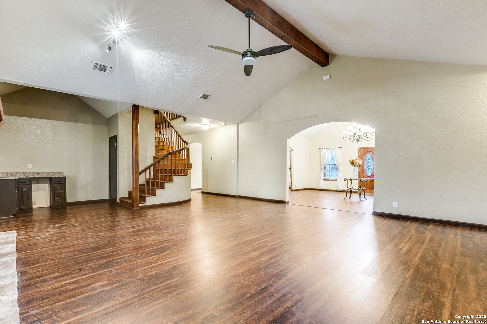 1505 30th Street Hondo, TX 78861 - Photo 21 of 35 a view of a room with wooden floor stairs and windows