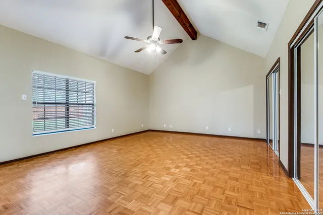 a view of an empty room with a window