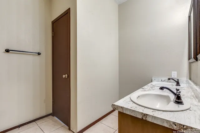a bathroom with a sink toilet and vanity