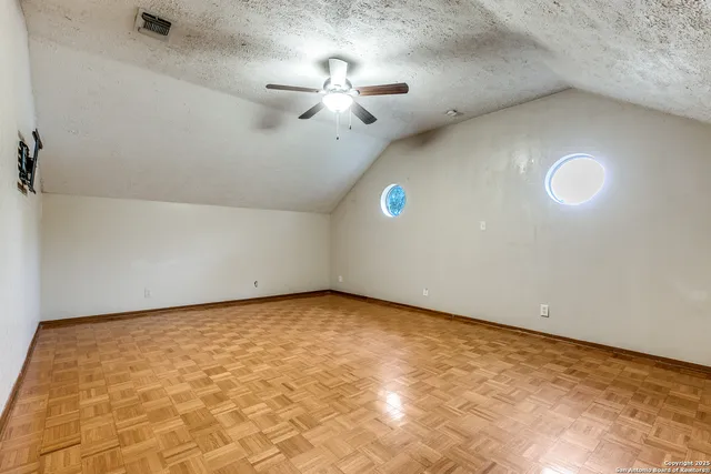a view of a big room with windows