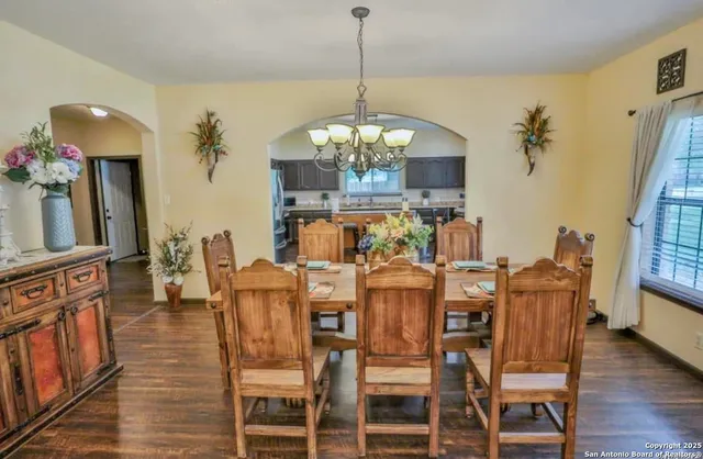 a view of a dining room with furniture and wooden floor