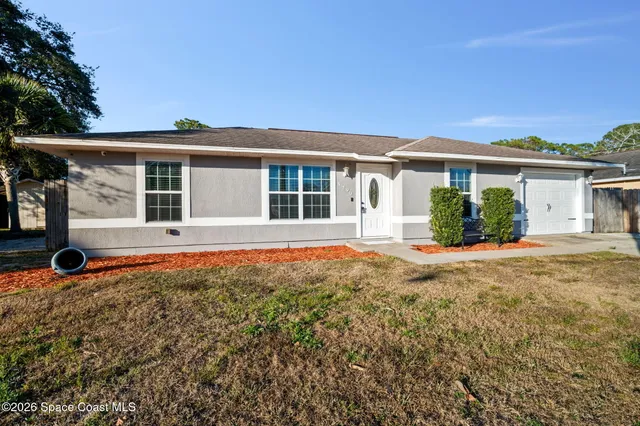 front view of a house with a yard