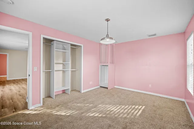 a view of a room with a chandelier