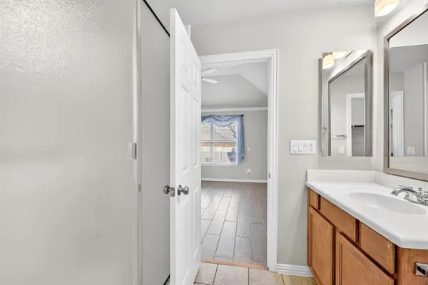 a bathroom with a sink and a mirror