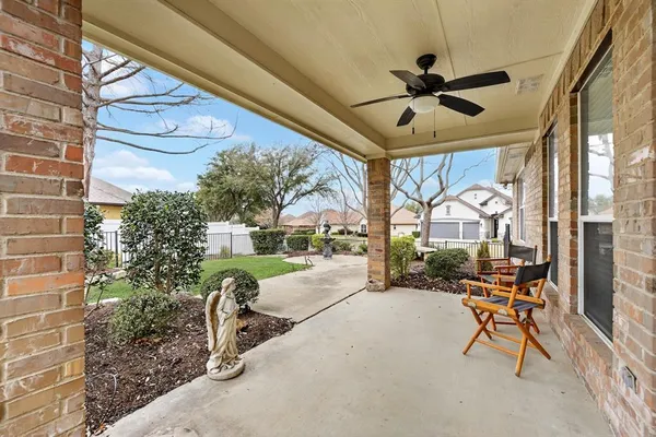 a view of a porch with chairs and couches