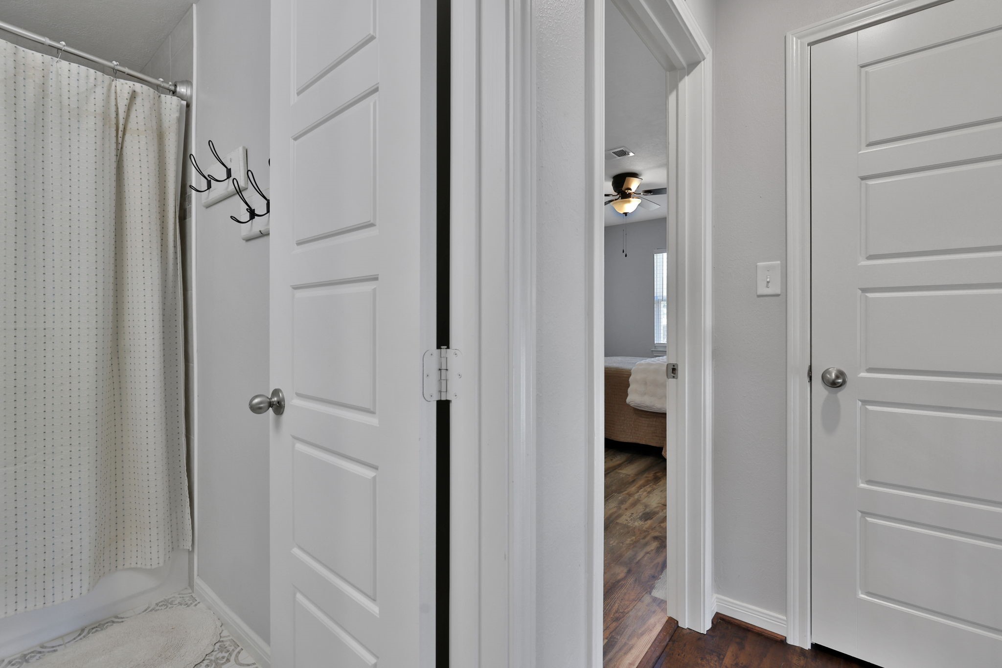 20 Ridgeway Drive Coldspring, TX 77331 - Photo 10 of 40 Guest bathroom, primary bedroom, and a closet for storage