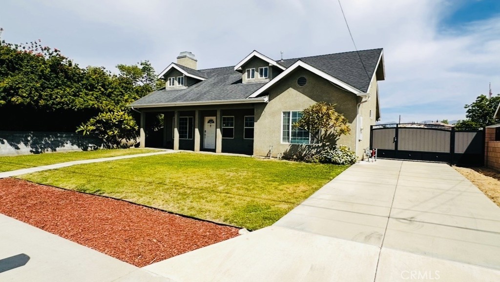 514 West Randall Avenue Rialto, CA 92376 - Photo 2 of 19 a view of outdoor space yard and swimming pool