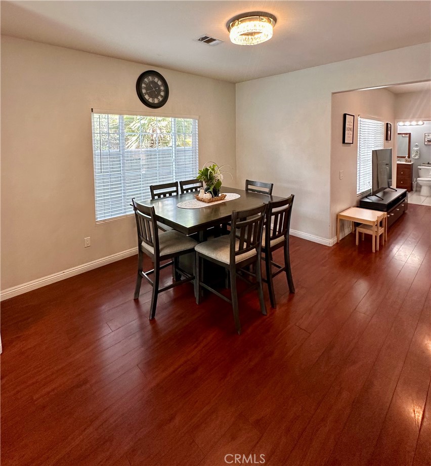514 West Randall Avenue Rialto, CA 92376 - Photo 6 of 19 a view of a dining room with furniture window and wooden floor