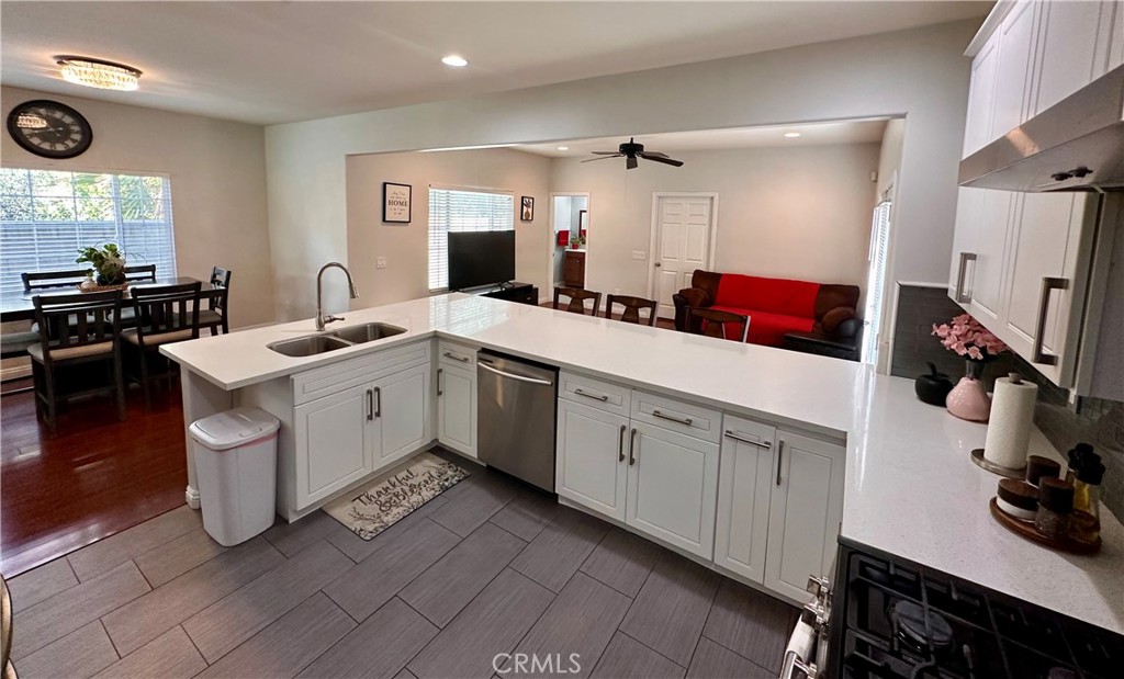 514 West Randall Avenue Rialto, CA 92376 - Photo 8 of 19 a kitchen with a sink stove and cabinets