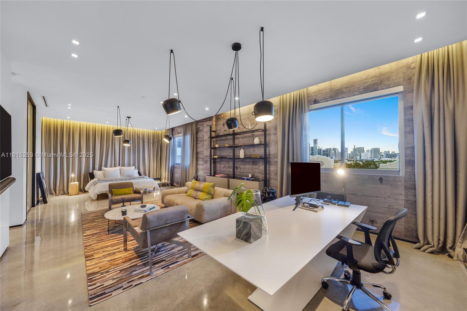 250 Northwest 24th Street, Unit PHA Miami, FL 33127 - Photo 12 of 68 a living room with furniture a rug and a chandelier