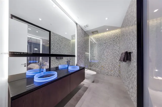 a hallway with dining table and chairs