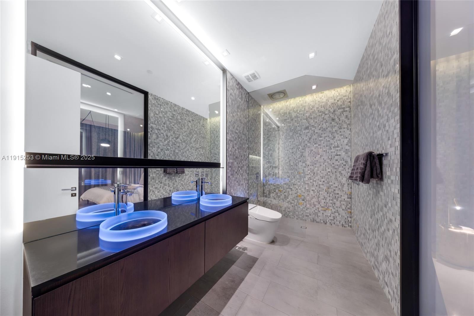 250 Northwest 24th Street, Unit PHA Miami, FL 33127 - Photo 17 of 68 a bathroom with a sink and a toilet