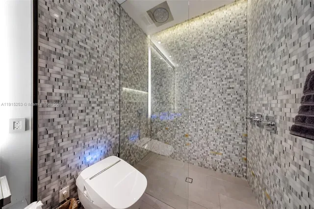 a large kitchen with a table and chairs