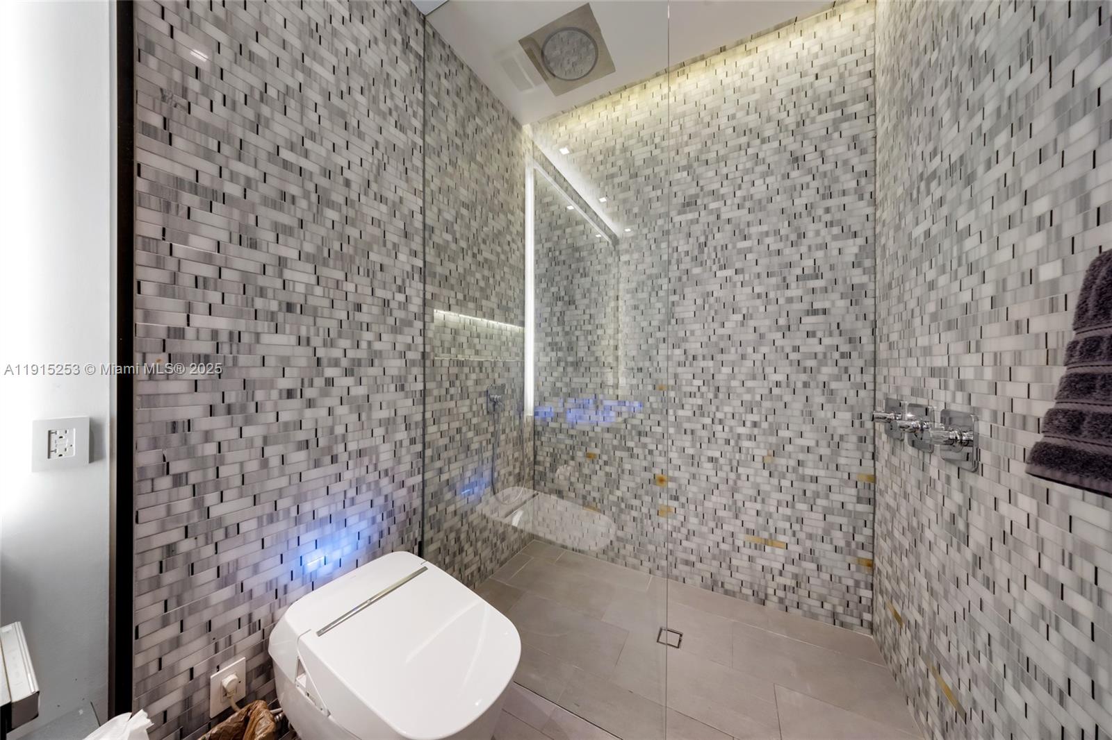 250 Northwest 24th Street, Unit PHA Miami, FL 33127 - Photo 18 of 68 a bathroom with a toilet and a shower