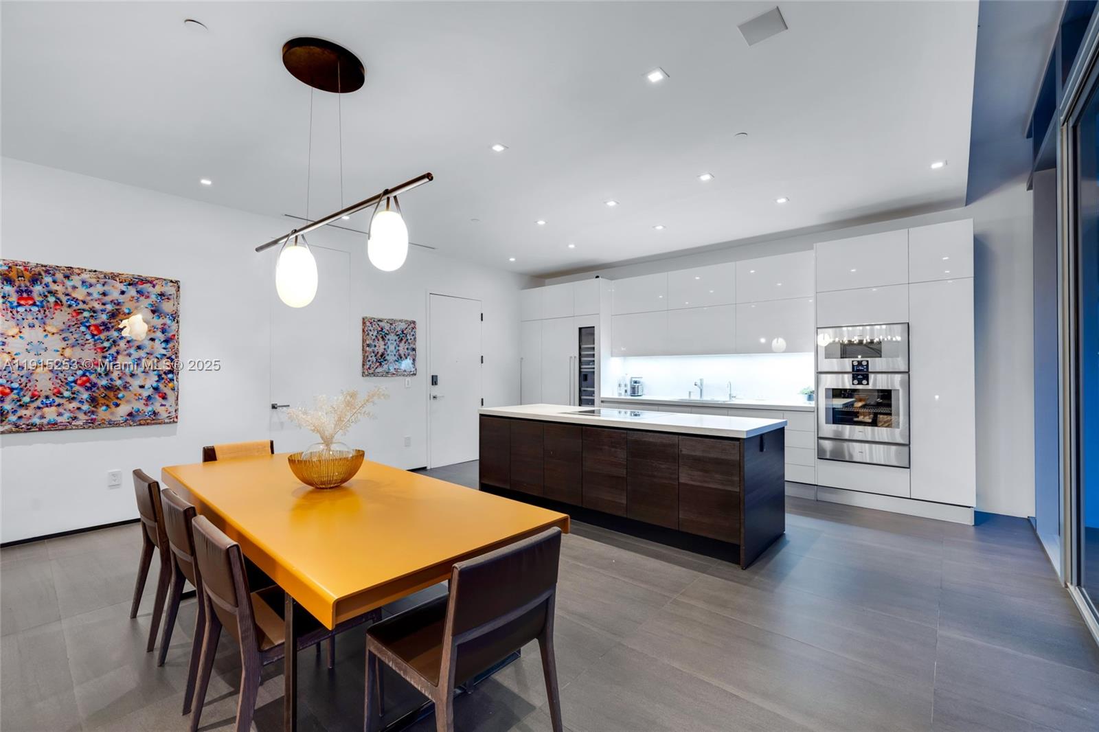 250 Northwest 24th Street, Unit PHA Miami, FL 33127 - Photo 20 of 68 a large kitchen with a table and chairs