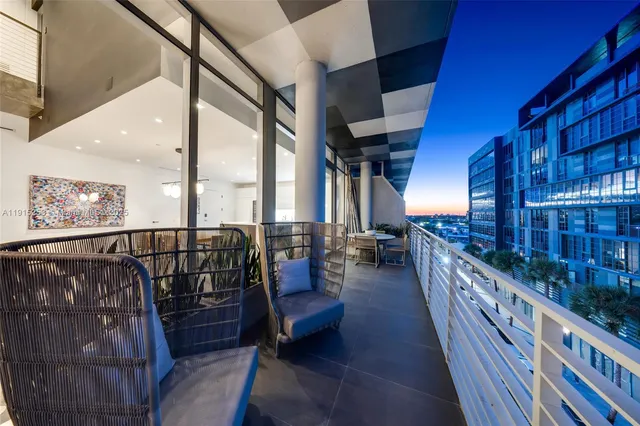 a hall with a cabinet and a flat screen tv