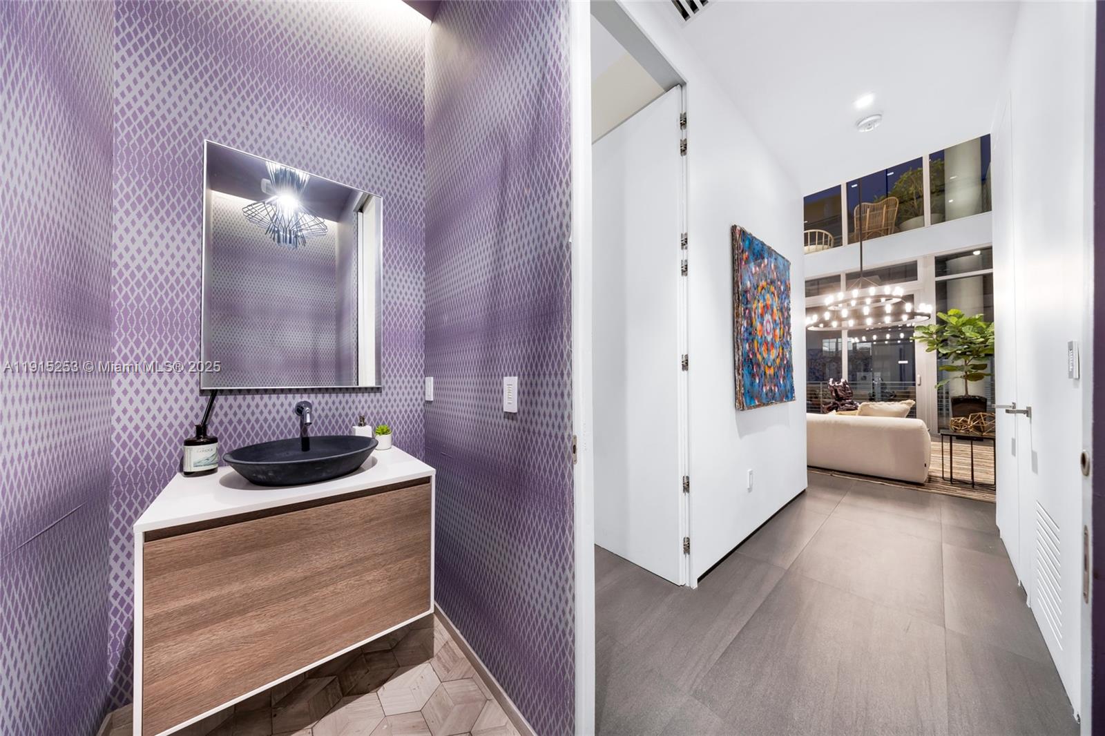 250 Northwest 24th Street, Unit PHA Miami, FL 33127 - Photo 41 of 68 a bathroom with a sink a tub and a mirror