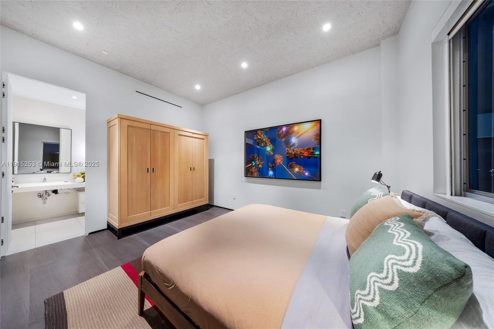 250 Northwest 24th Street, Unit PHA Miami, FL 33127 - Photo 43 of 68 a hall with a cabinet and a flat screen tv