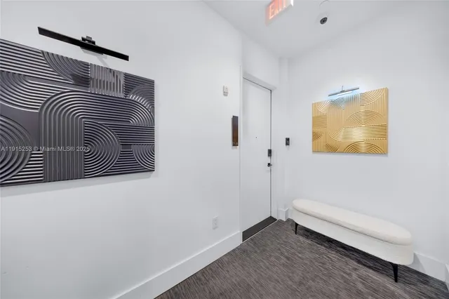 a view of a patio with furniture and a garden