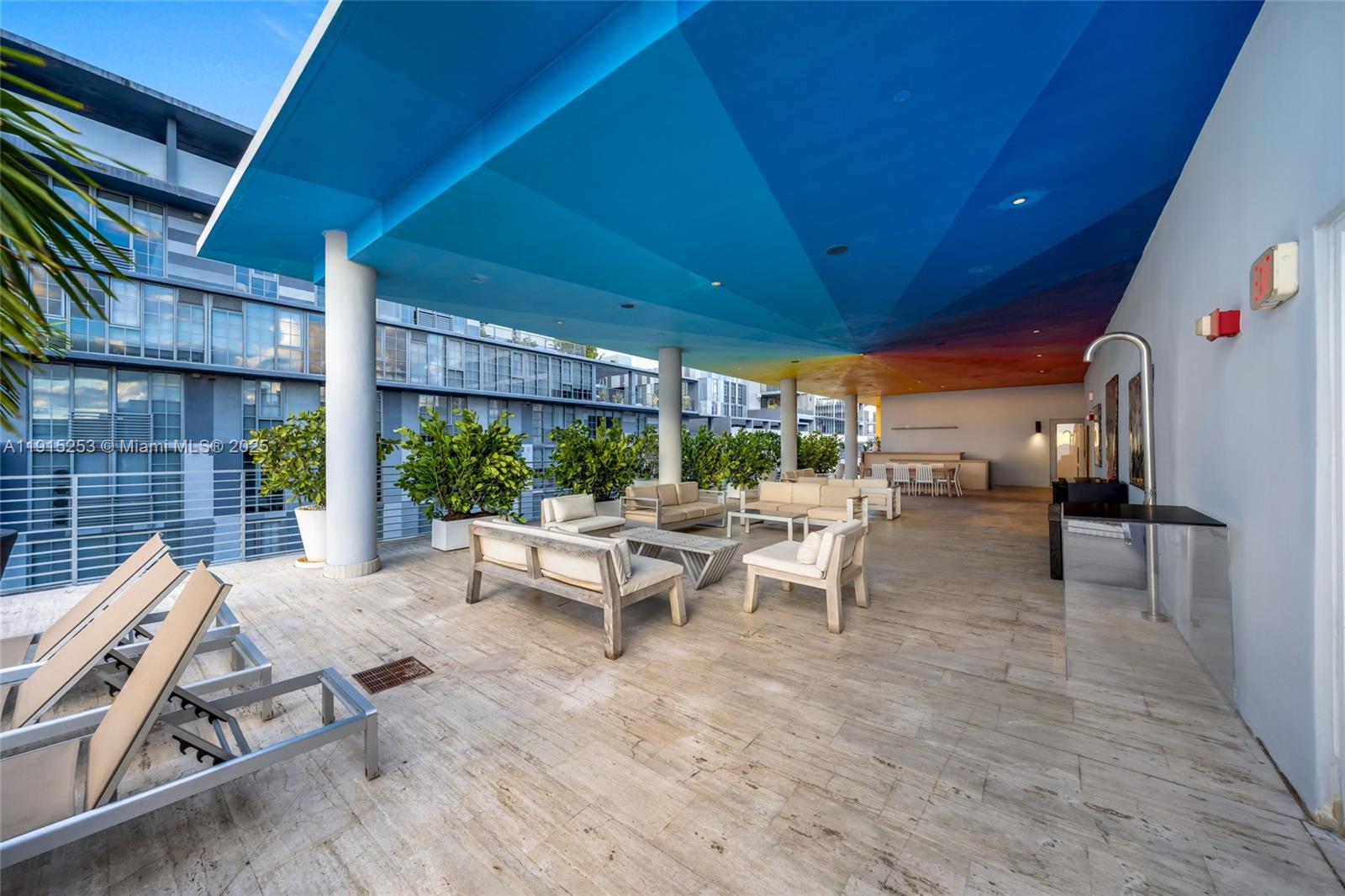 250 Northwest 24th Street, Unit PHA Miami, FL 33127 - Photo 48 of 68 a building outdoor space with patio furniture and potted plants