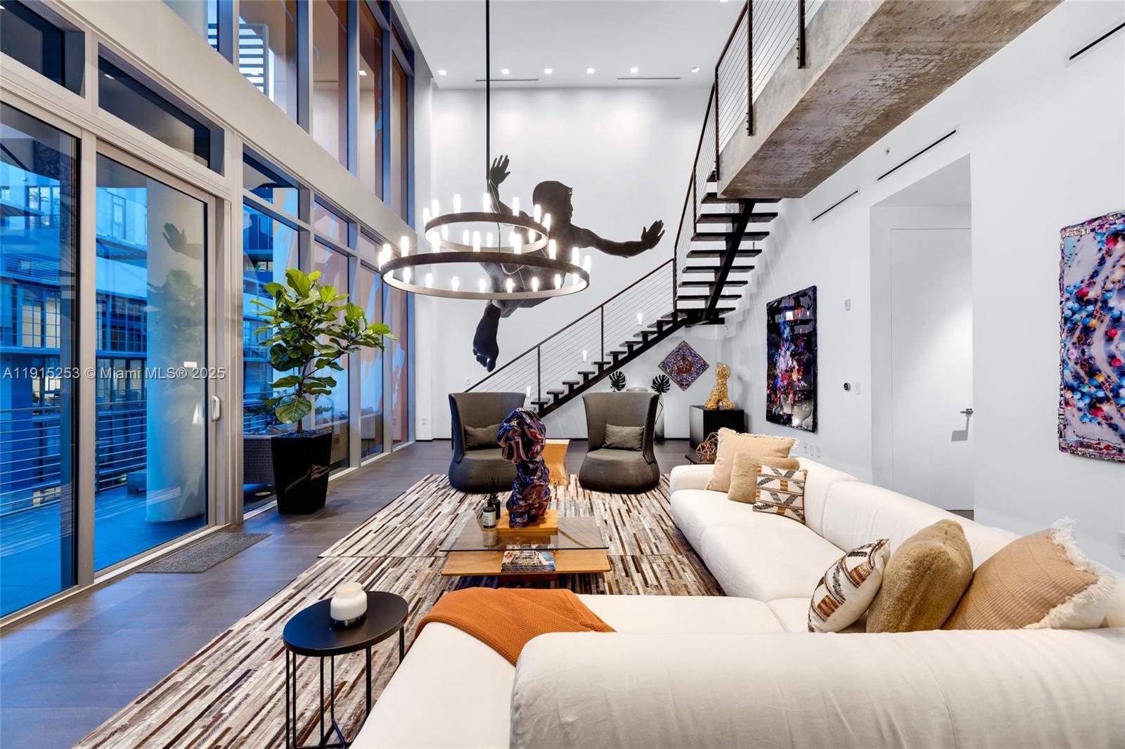 250 Northwest 24th Street, Unit PHA Miami, FL 33127 - Photo 5 of 68 a living room with furniture