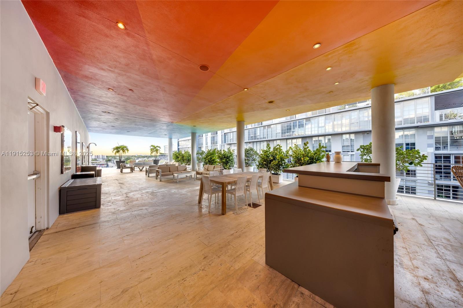 250 Northwest 24th Street, Unit PHA Miami, FL 33127 - Photo 59 of 68 a living room with couches and kitchen view