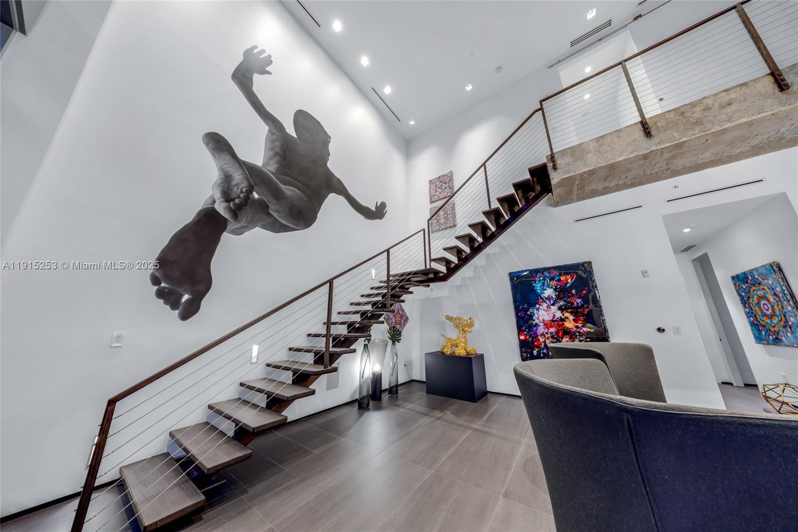 250 Northwest 24th Street, Unit PHA Miami, FL 33127 - Photo 8 of 68 a living room with furniture and stairs