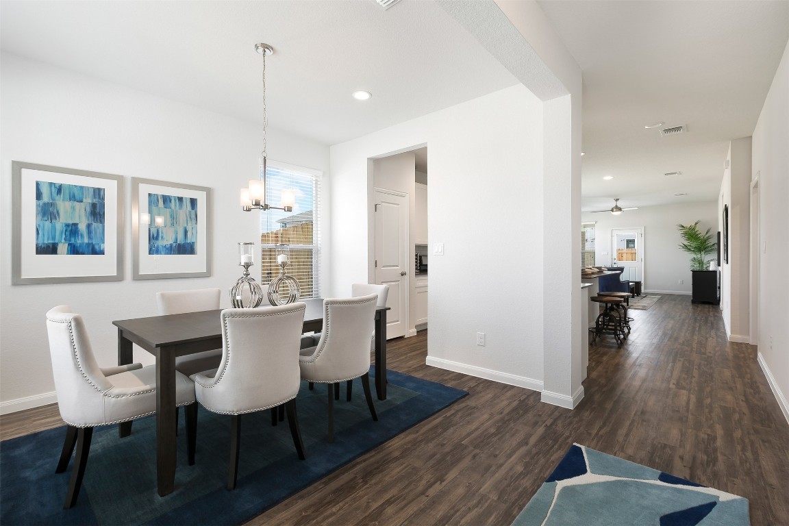 128 Saguaro Trail Georgetown, TX 78626 - Photo 2 of 9 a view of a dining room with furniture and wooden floor