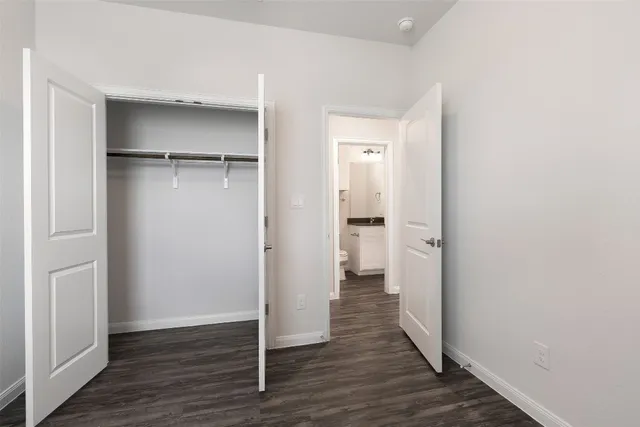 a view of a room with wooden floor