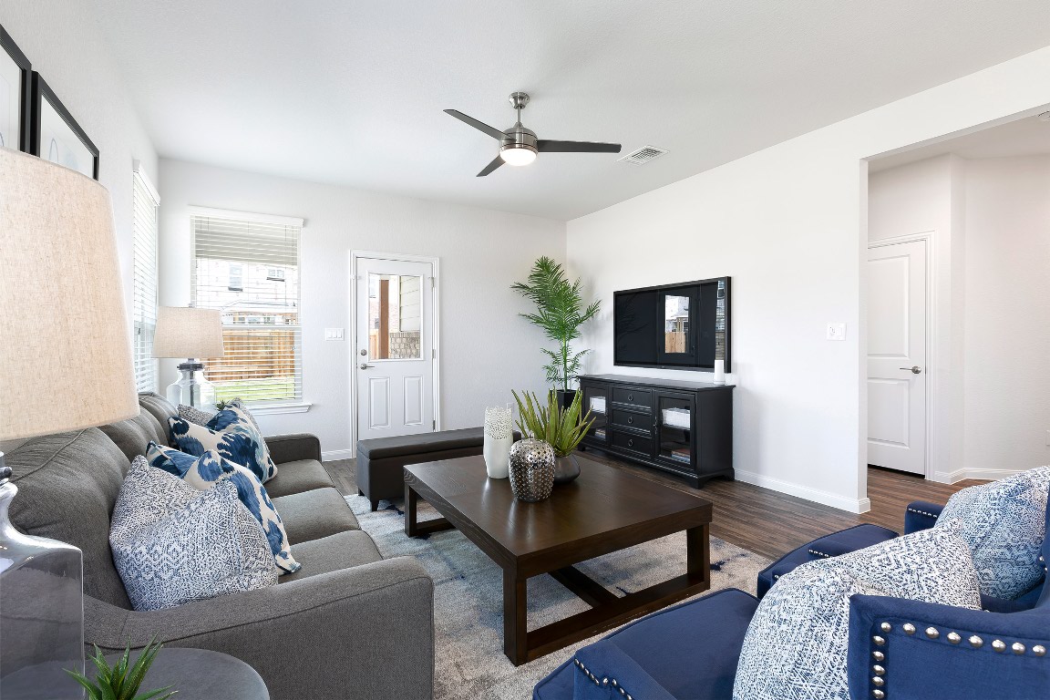 128 Saguaro Trail Georgetown, TX 78626 - Photo 7 of 9 a living room with furniture and a flat screen tv