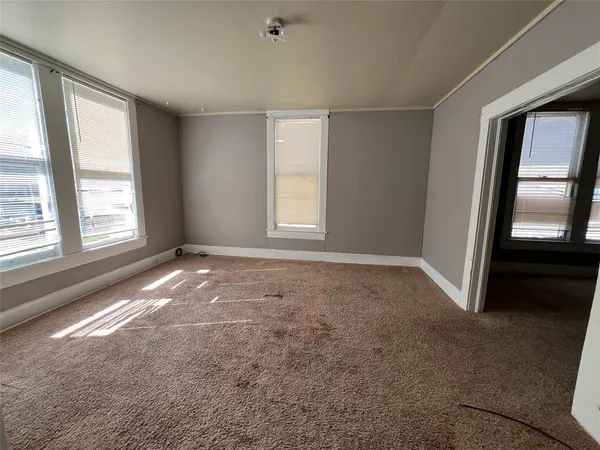 a view of empty room with windows