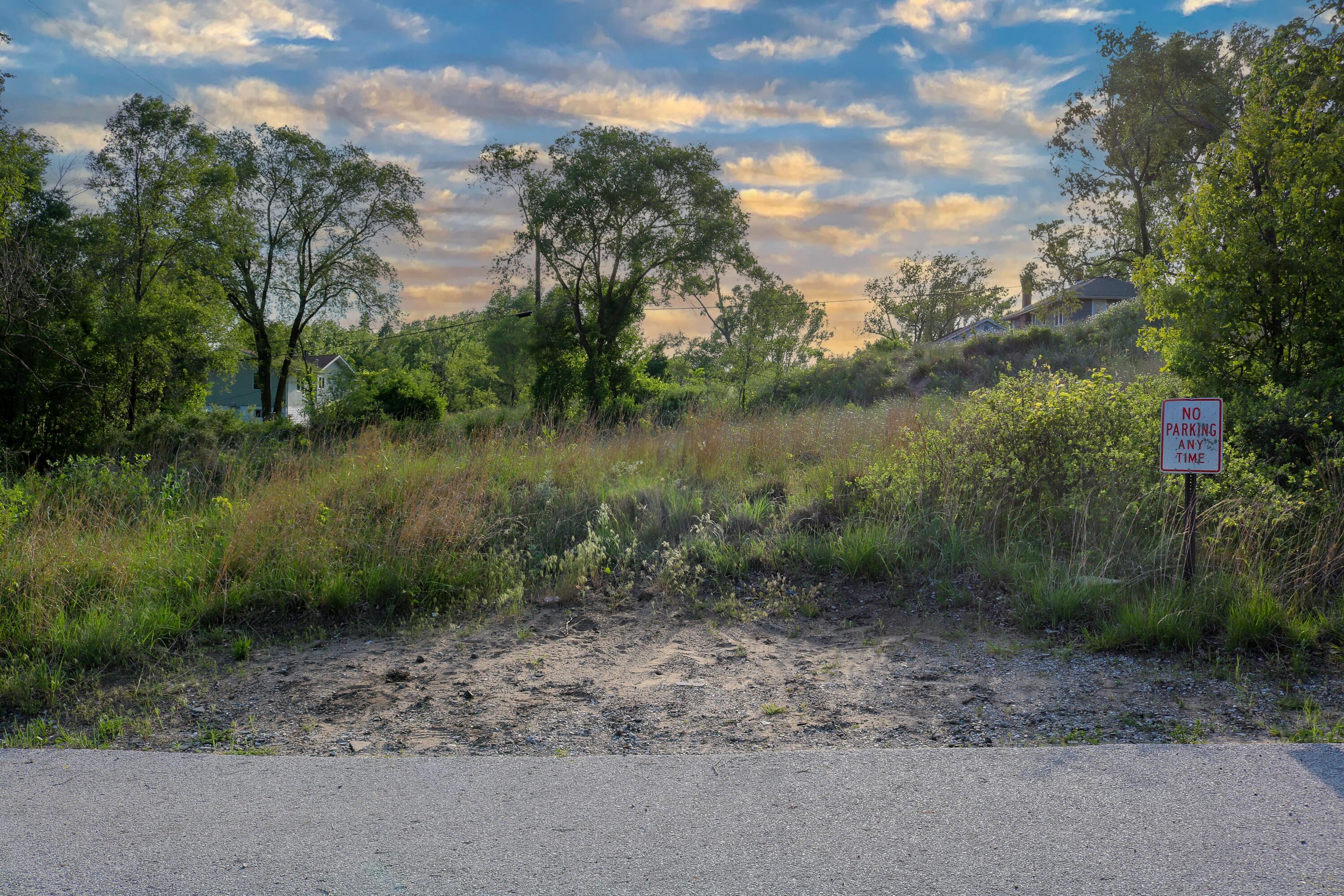 1200-02 North County Line Road Gary, IN 46403 - Photo 2 of 37 a view of a lake with a yard