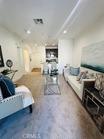 a living room with furniture and a couch