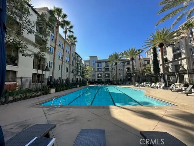 a small white building with a palm trees