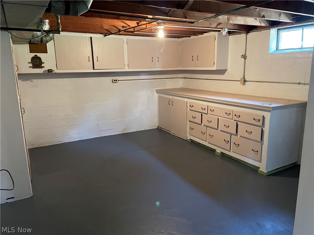 24800 Emery Road Warrensville Heights, OH 44128 - Photo 13 of 17 Work area in lower level with built-in storage