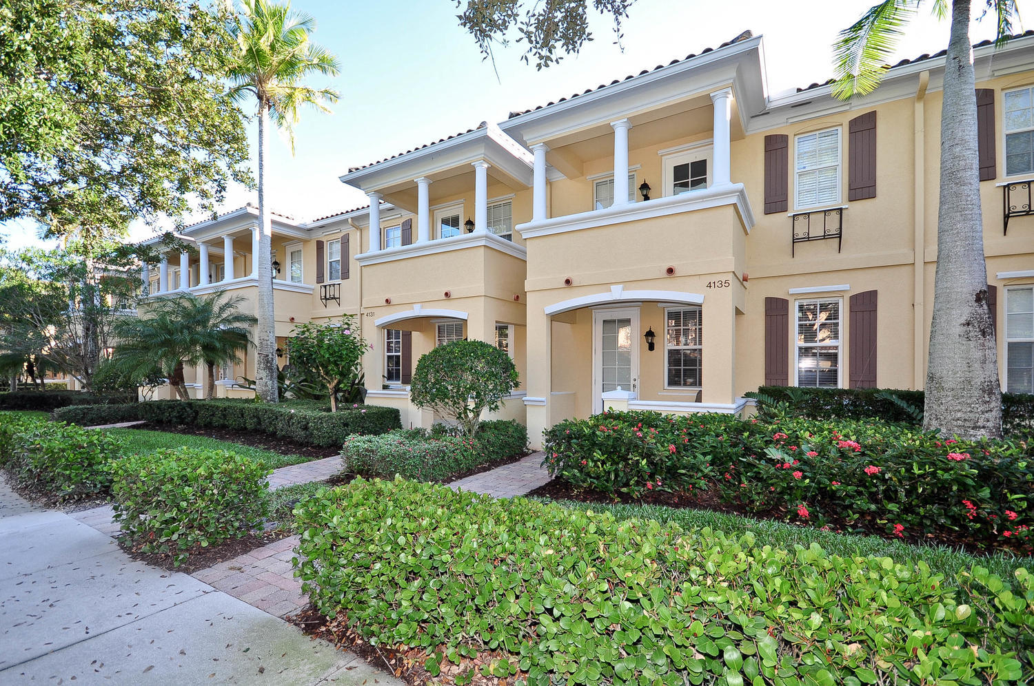 4135 Community Drive Jupiter, FL 33458 - Photo 1 of 39 front view of a house with a garden