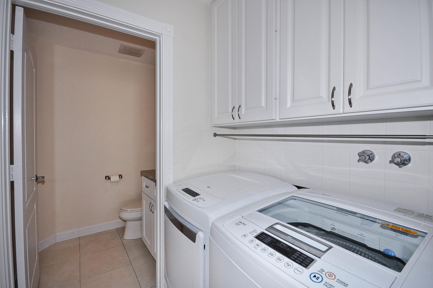4135 Community Drive Jupiter, FL 33458 - Photo 13 of 39 a utility room with dryer and washer