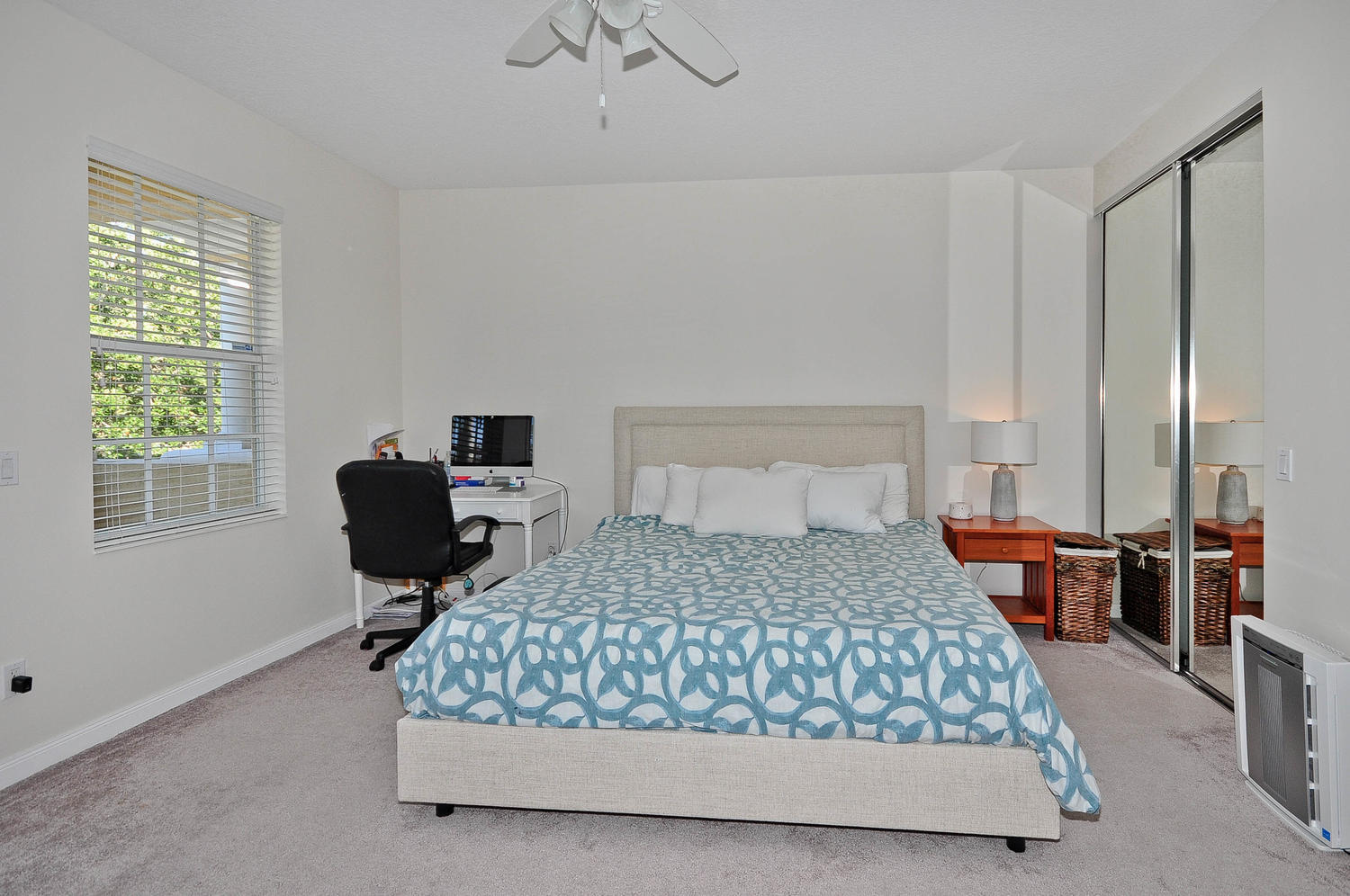 4135 Community Drive Jupiter, FL 33458 - Photo 18 of 39 a bedroom with a bed chair and window