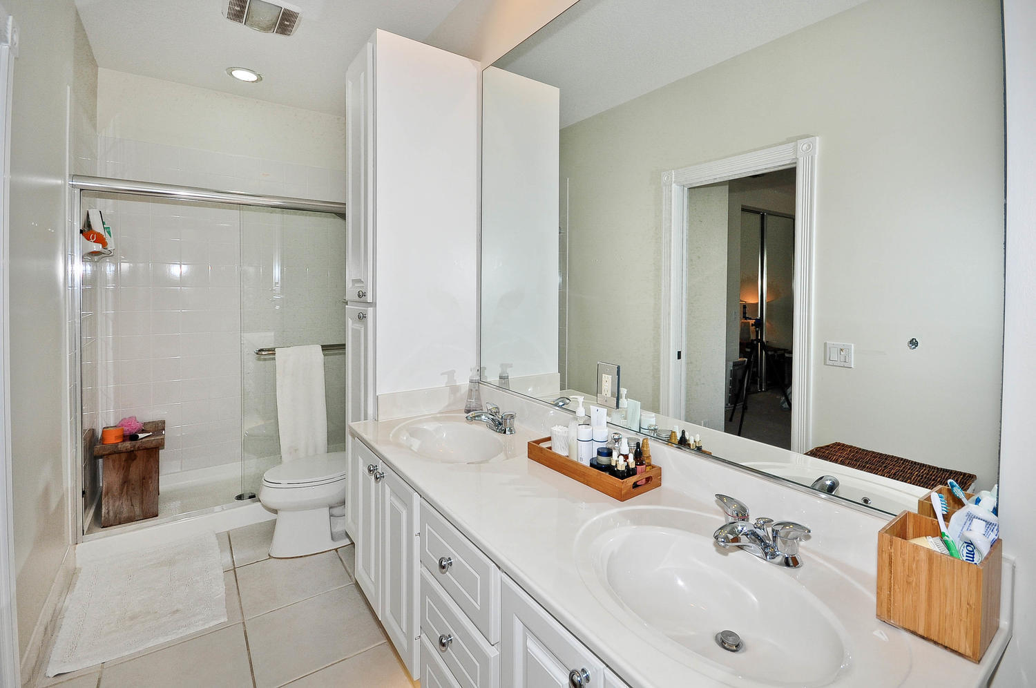 4135 Community Drive Jupiter, FL 33458 - Photo 25 of 39 a bathroom with a double vanity sink mirror and double