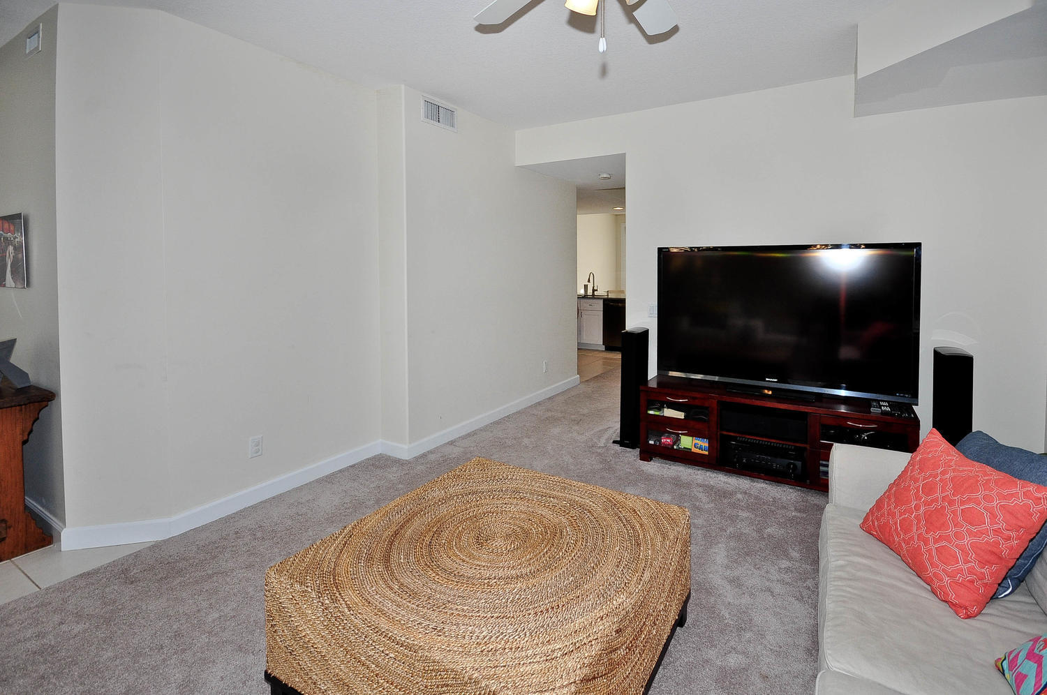 4135 Community Drive Jupiter, FL 33458 - Photo 5 of 39 a living room with furniture and a flat screen tv
