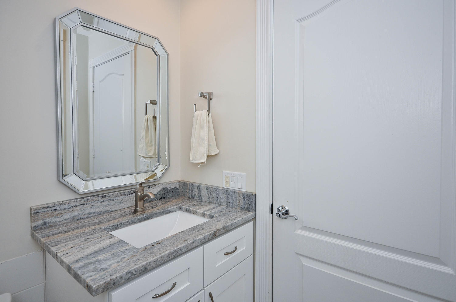 4135 Community Drive Jupiter, FL 33458 - Photo 6 of 39 a bathroom with a granite countertop sink and a mirror