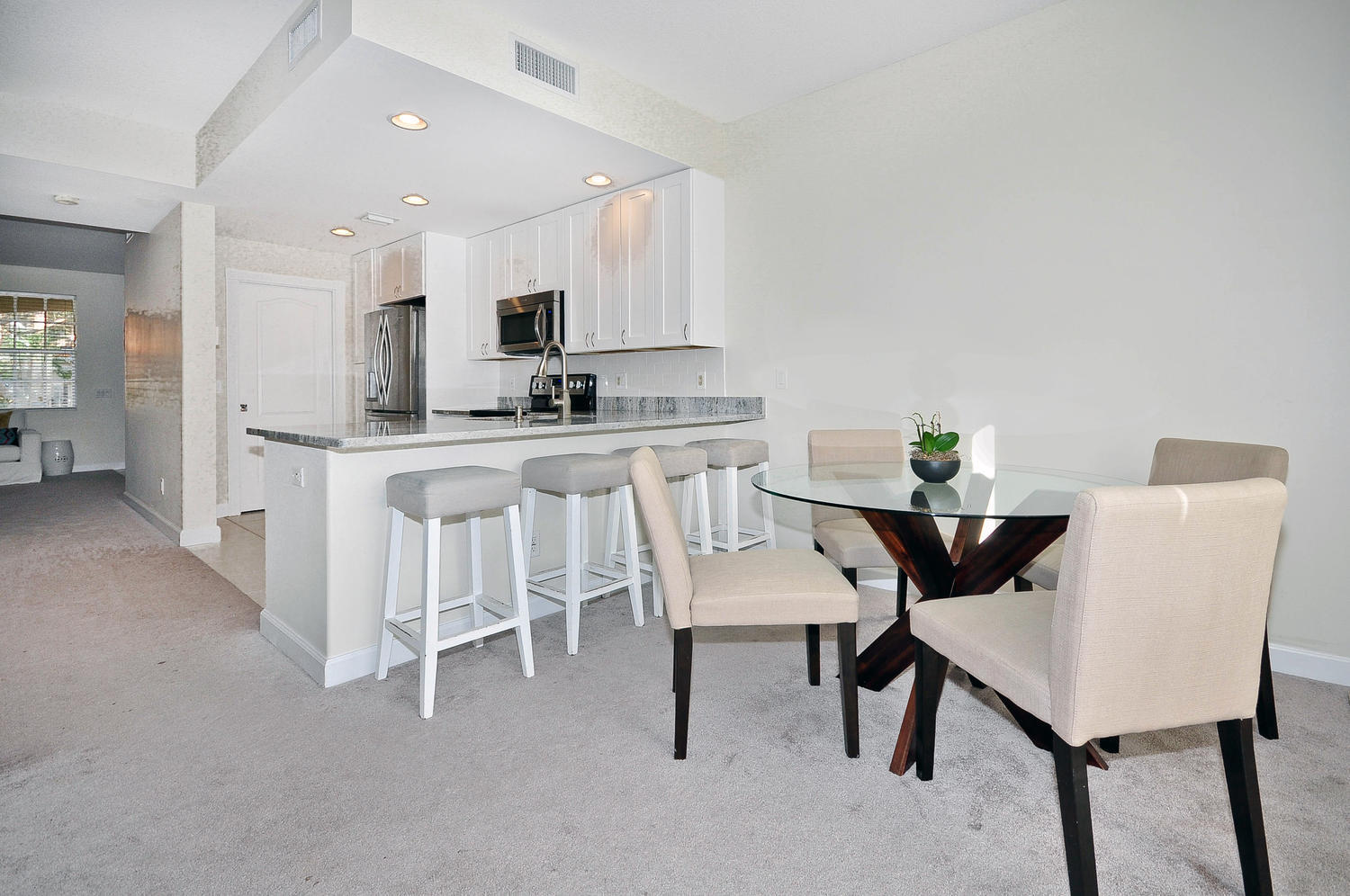 4135 Community Drive Jupiter, FL 33458 - Photo 9 of 39 a view of kitchen with table and chairs