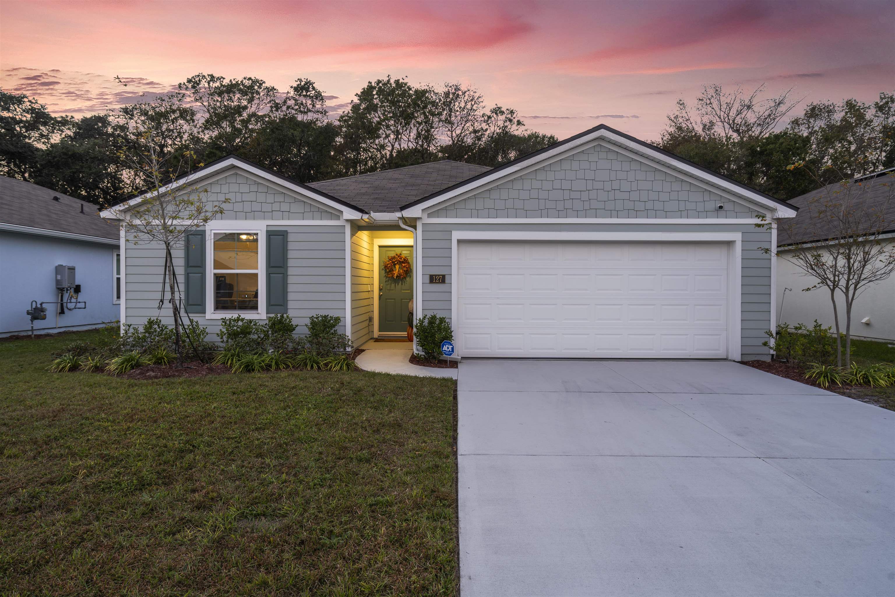 a front view of a house with garden