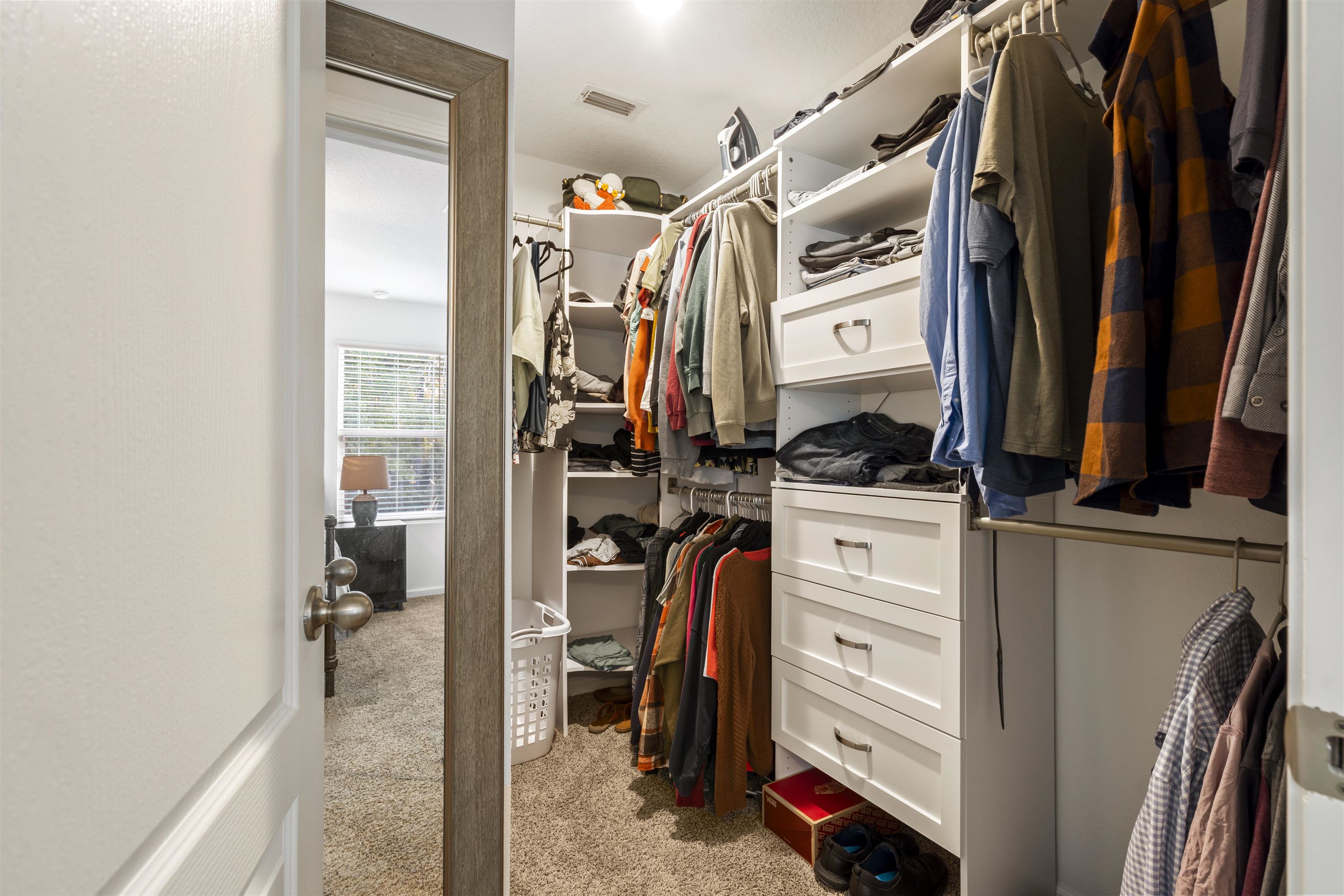 127 Encanto Way St. Augustine, FL 32084 - Photo 19 of 43 a view of walk in closet with clothes and shoes