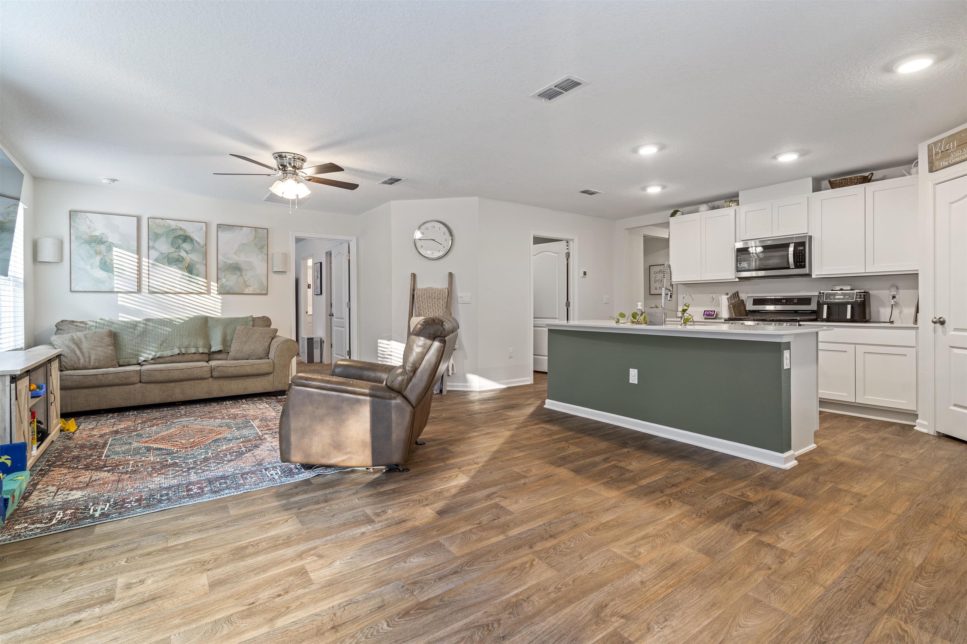 127 Encanto Way St. Augustine, FL 32084 - Photo 2 of 43 a living room with stainless steel appliances furniture and a kitchen view