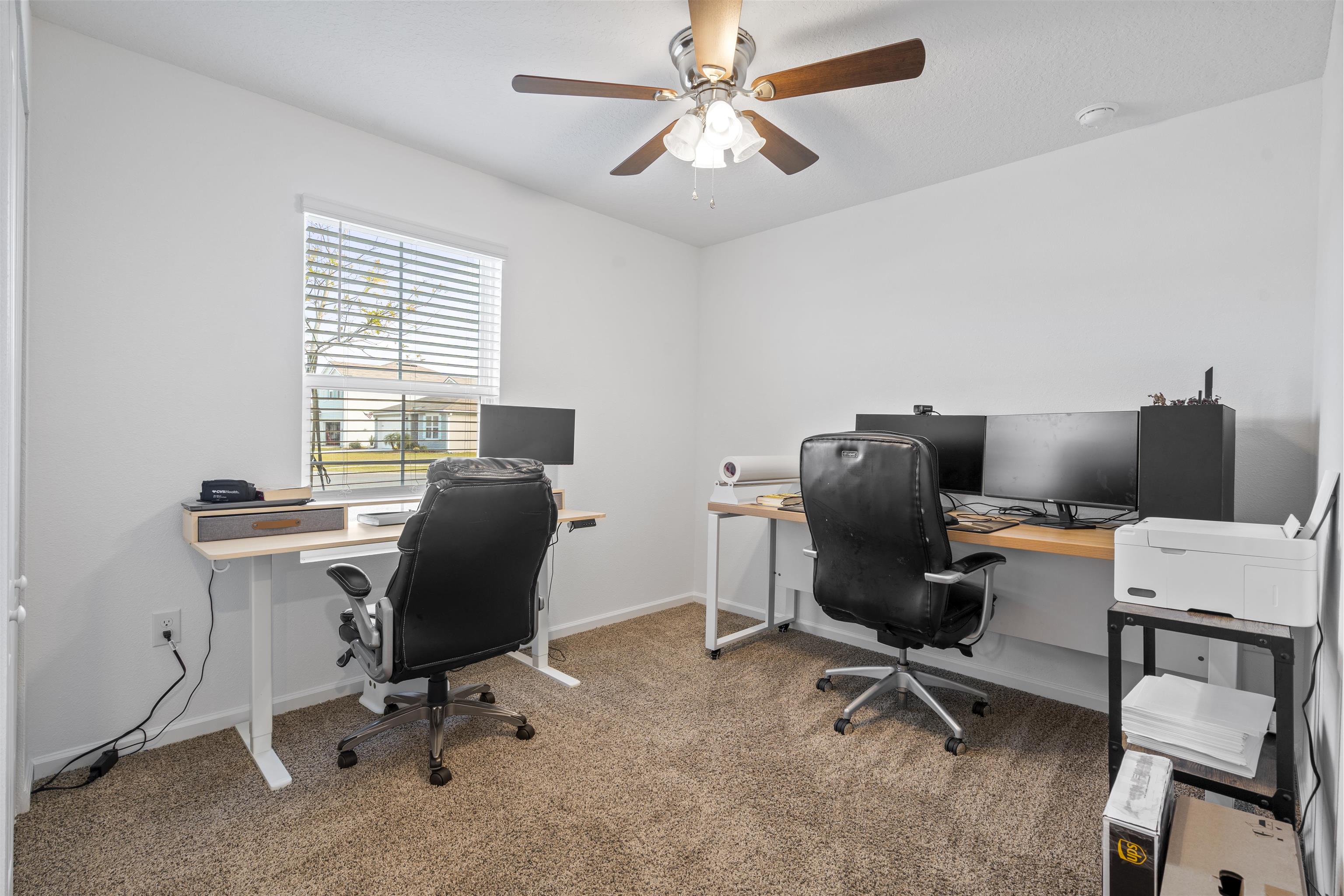 127 Encanto Way St. Augustine, FL 32084 - Photo 20 of 43 a view of a workspace with furniture and a window