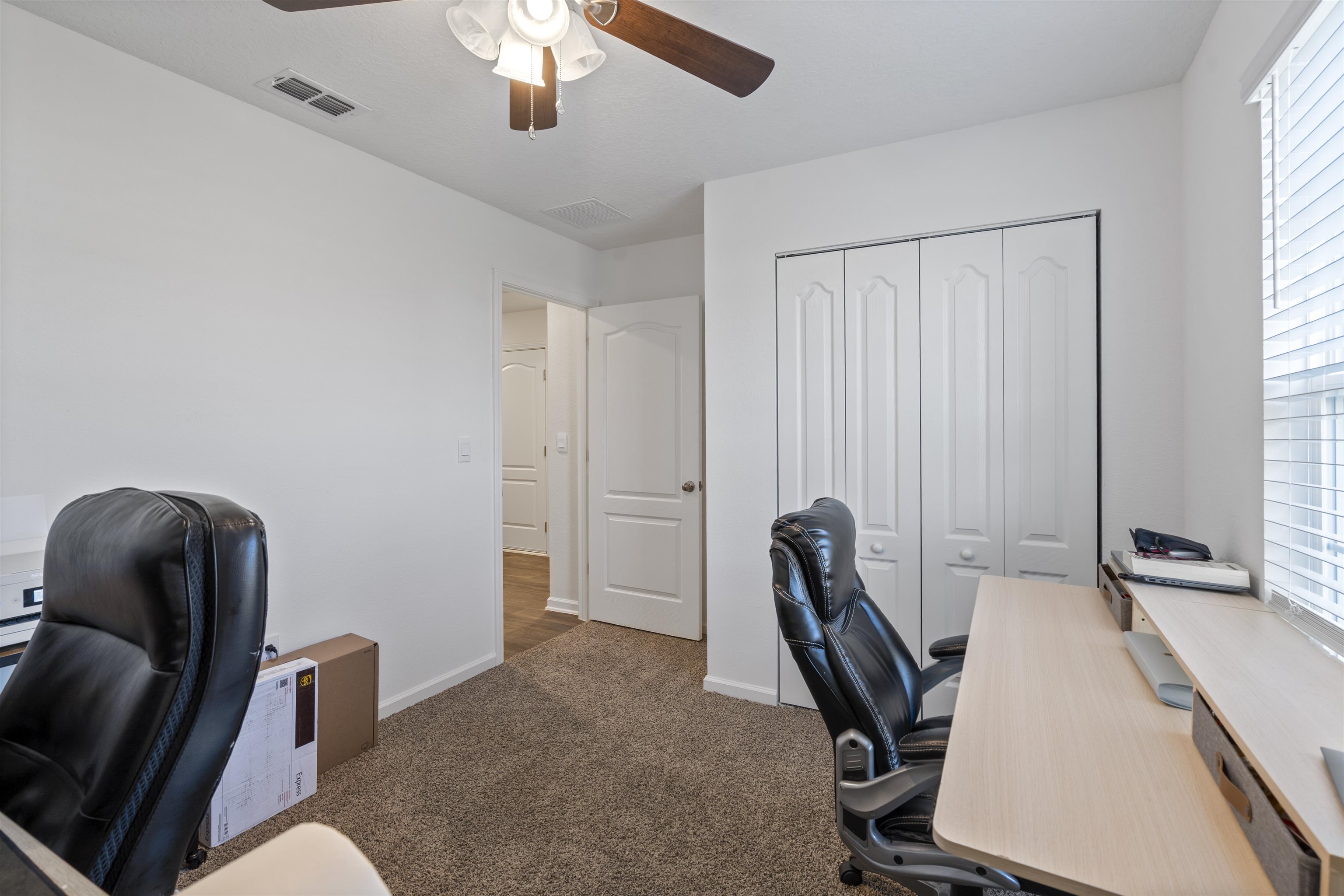 127 Encanto Way St. Augustine, FL 32084 - Photo 21 of 43 a view of a workspace with furniture and a window