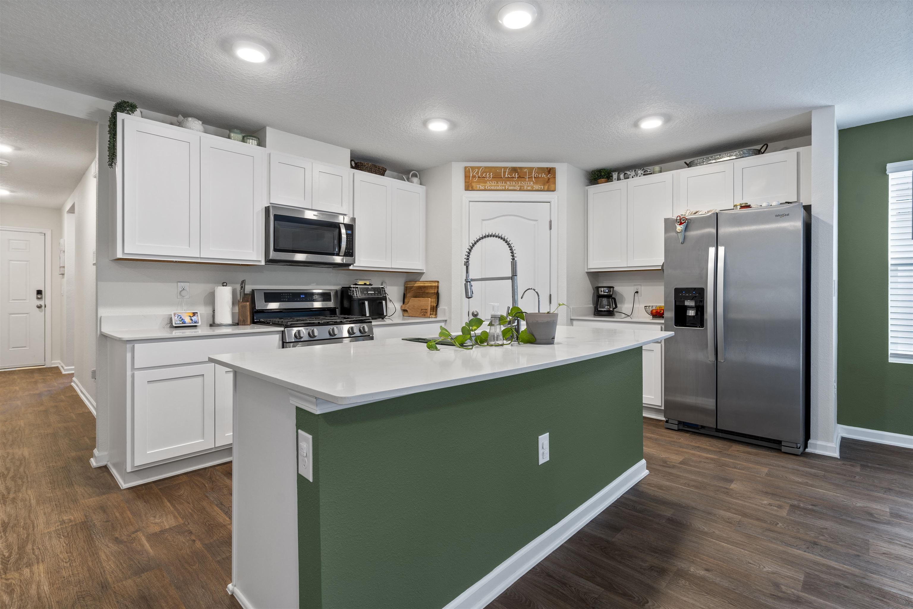 127 Encanto Way St. Augustine, FL 32084 - Photo 3 of 43 a kitchen with kitchen island a sink stainless steel appliances and cabinets